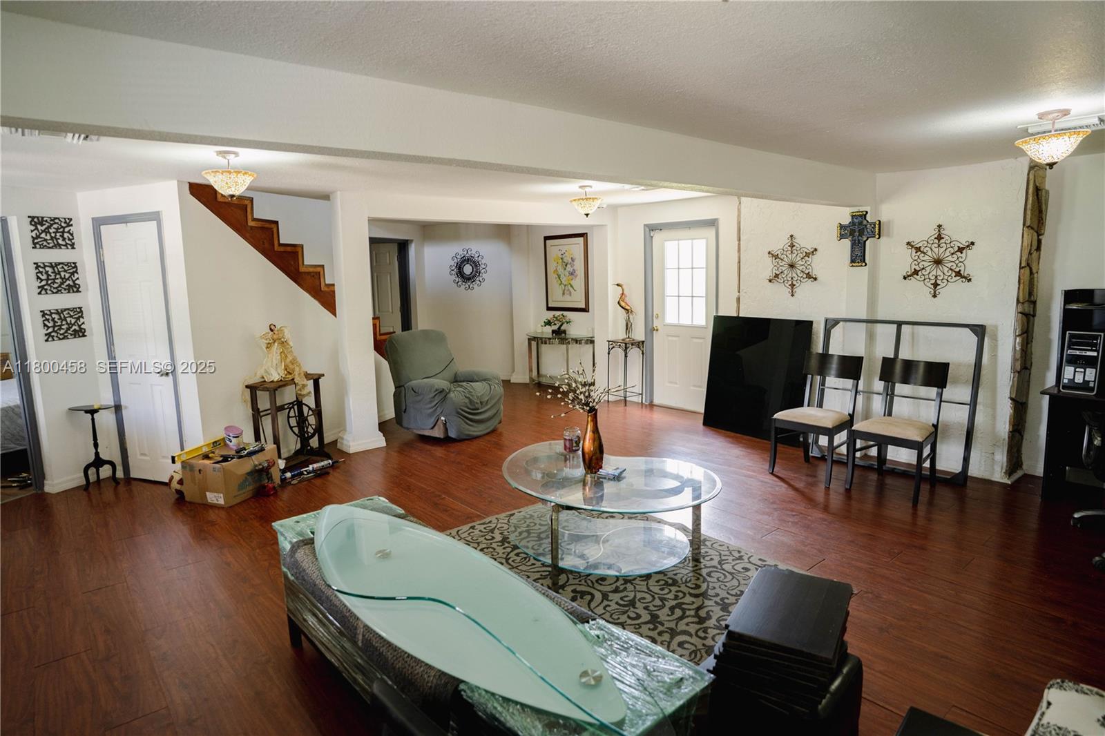 North Okeechobee Okeechobee, FL 34972 - Photo 2 of 23 a living room with furniture and wooden floor