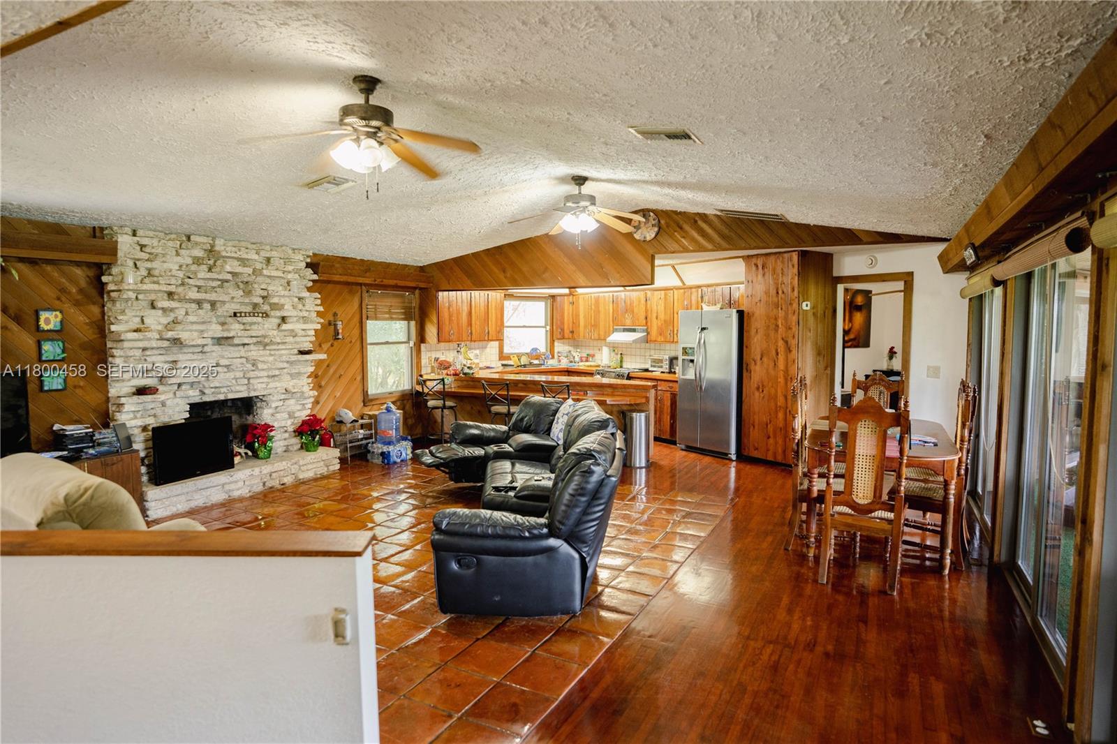 North Okeechobee Okeechobee, FL 34972 - Photo 8 of 23 a living room with fireplace furniture and a wooden floor