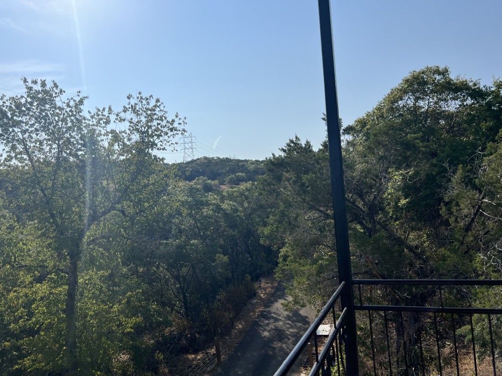 19600 Bee Creek Tavern Road, Unit B Spicewood, TX 78669 - Photo 5 of 13 a view of a balcony with an outdoor space