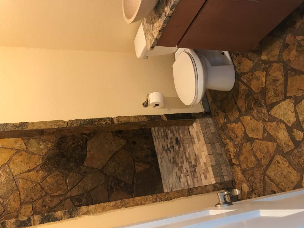 19600 Bee Creek Tavern Road, Unit B Spicewood, TX 78669 - Photo 8 of 13 a bathroom with a toilet and a shower