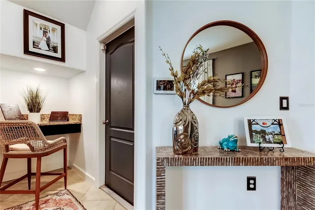 a view of a kitchen with a refrigerator and cabinets