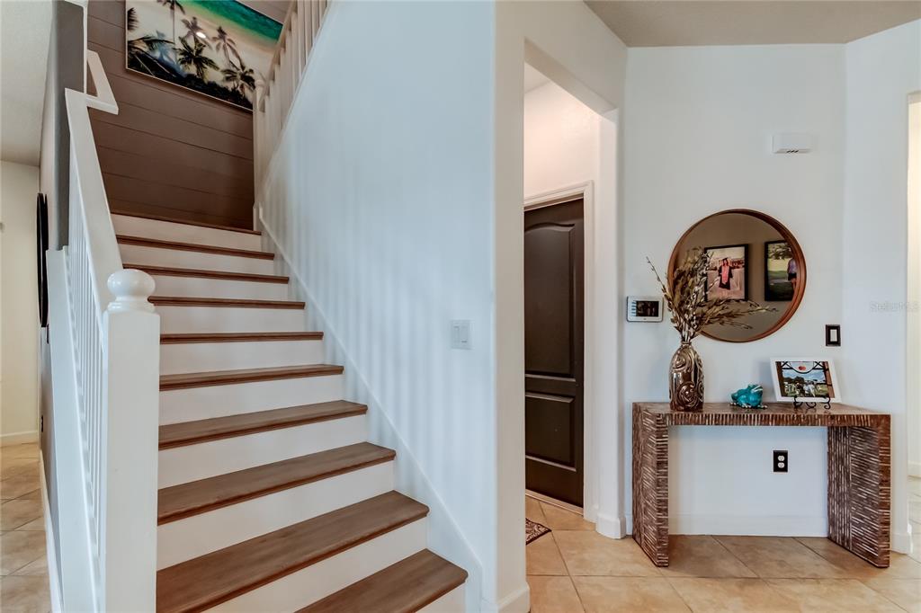 10141 Newminster Loop Ruskin, FL 33573 - Photo 33 of 77 a view of entryway with wooden floor