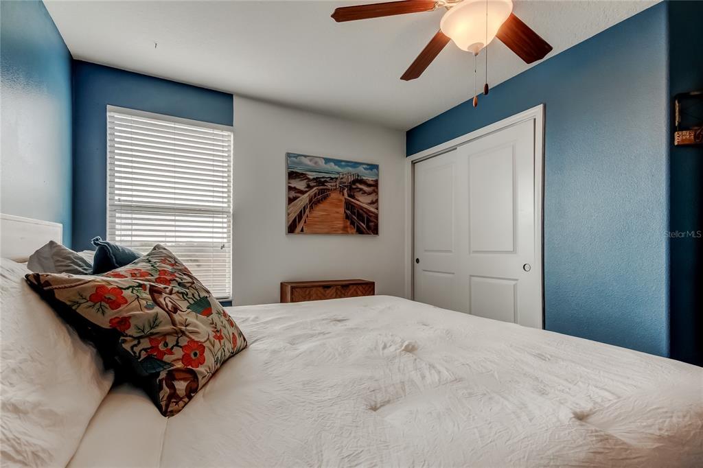 10141 Newminster Loop Ruskin, FL 33573 - Photo 35 of 77 a bedroom with bed and window