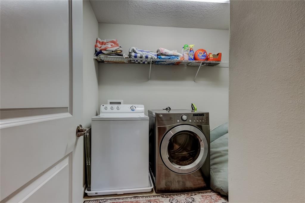 10141 Newminster Loop Ruskin, FL 33573 - Photo 44 of 77 a utility room with dryer and washer