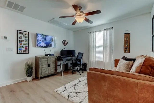 a view of a living room and dining room