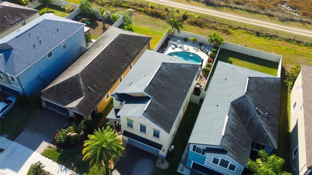 10141 Newminster Loop Ruskin, FL 33573 - Photo 5 of 77 an aerial view of a house with a garden