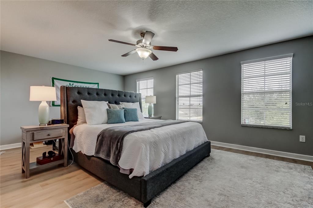 10141 Newminster Loop Ruskin, FL 33573 - Photo 54 of 77 a bedroom with a bed and a window