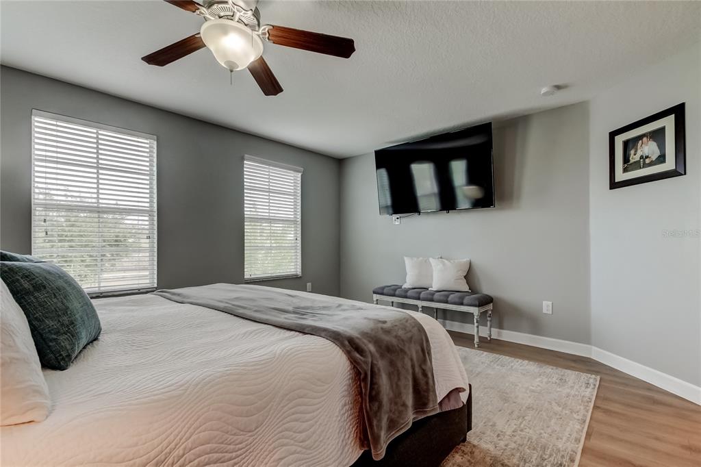 10141 Newminster Loop Ruskin, FL 33573 - Photo 55 of 77 a bedroom with a bed and a window