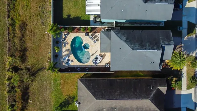 a living room with furniture ceiling fan and a rug