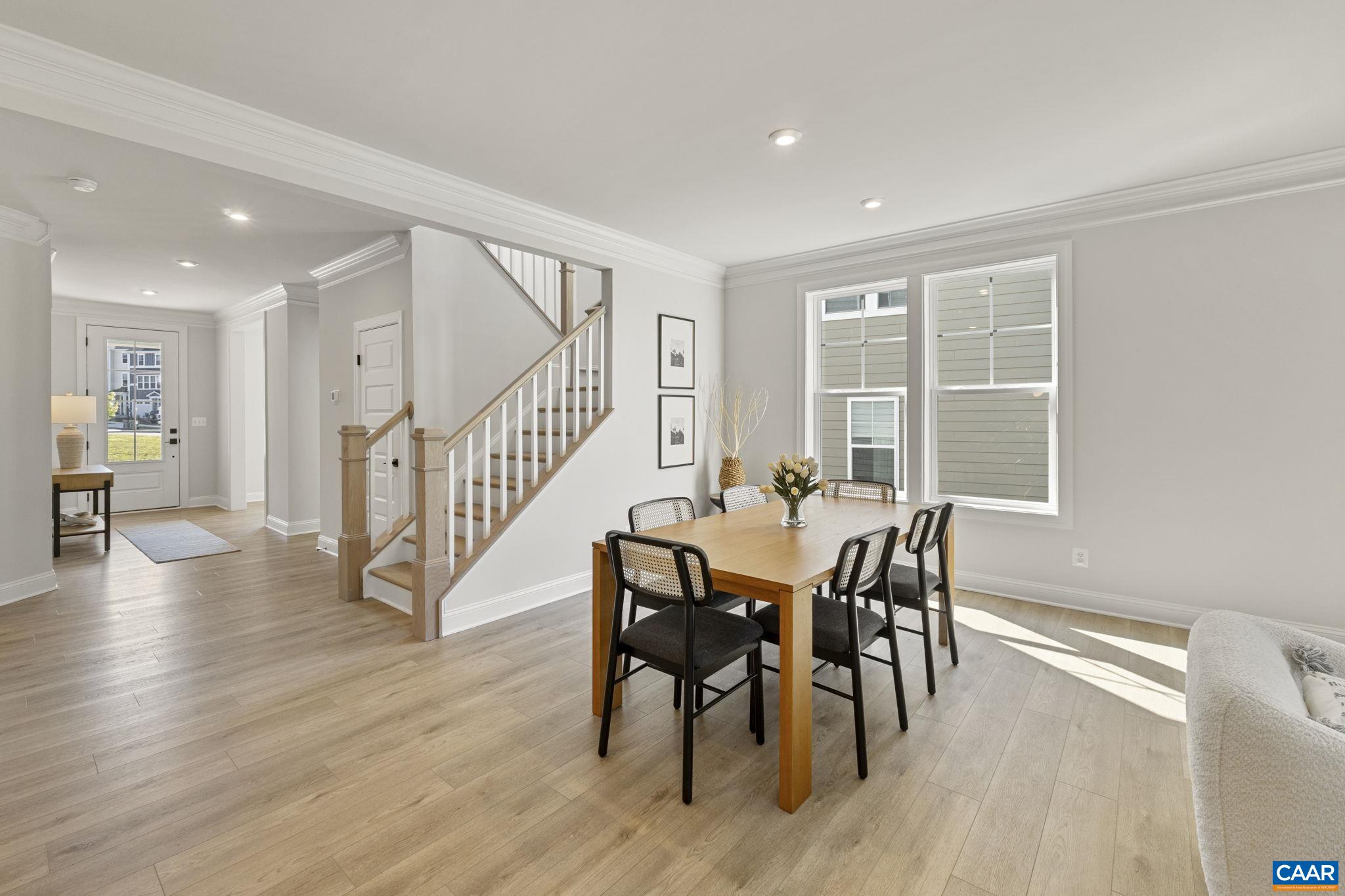 114 D Marcella Street Charlottesville, VA 22911 - Photo 11 of 58 a view of a dining room with furniture window and wooden floor