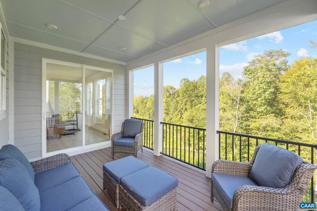 a kitchen with stainless steel appliances kitchen island granite countertop a table chairs stove and refrigerator
