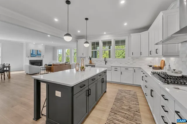 a large kitchen with a table and chairs