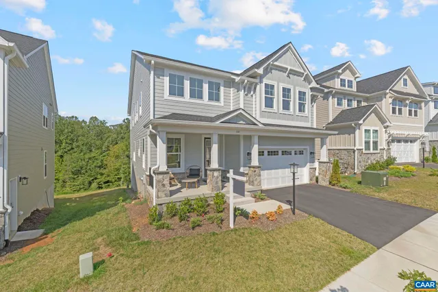 a view of a house with a yard porch and sitting area