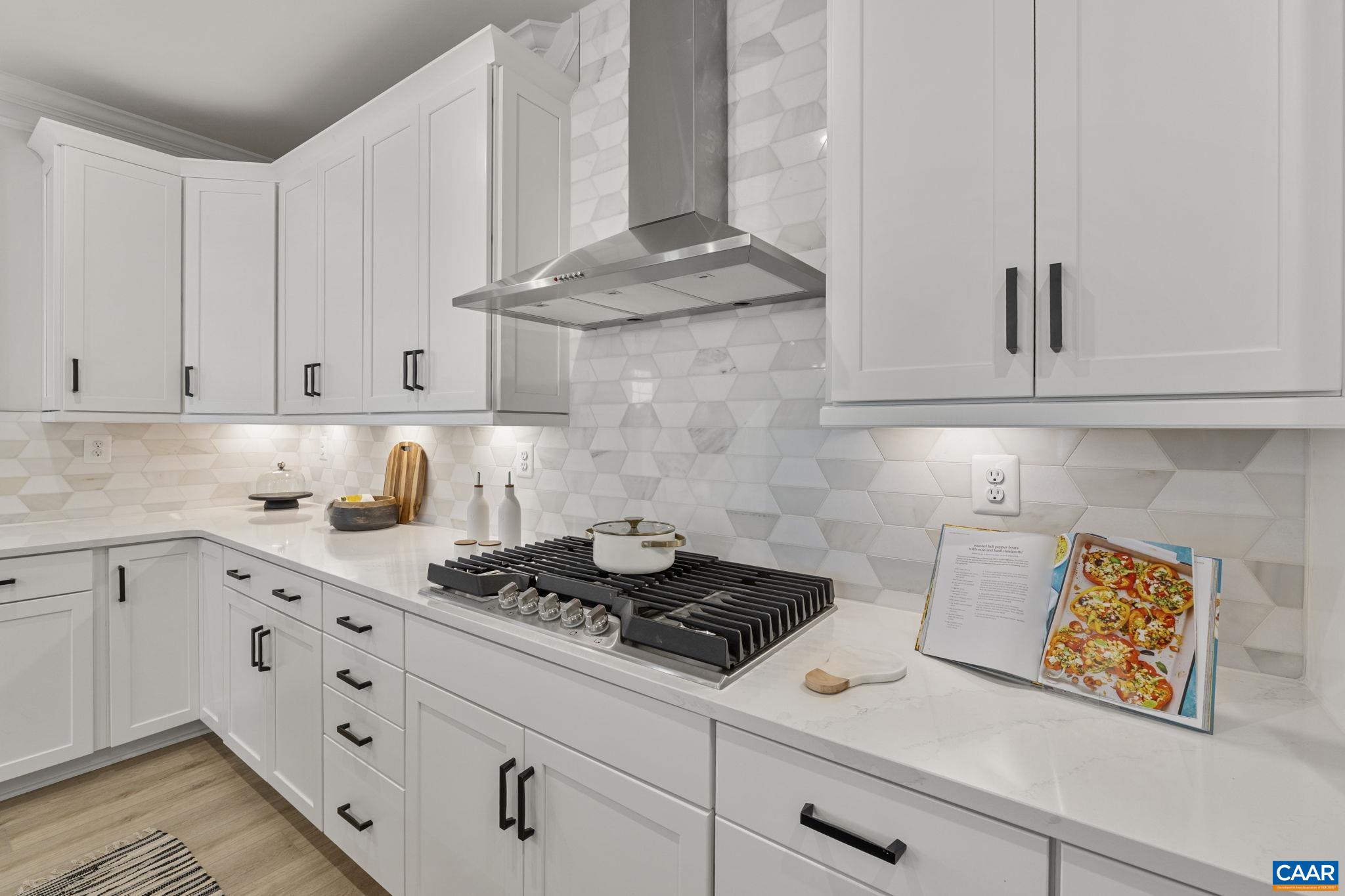 114 D Marcella Street Charlottesville, VA 22911 - Photo 21 of 58 a kitchen with stainless steel appliances granite countertop white cabinets and a stove