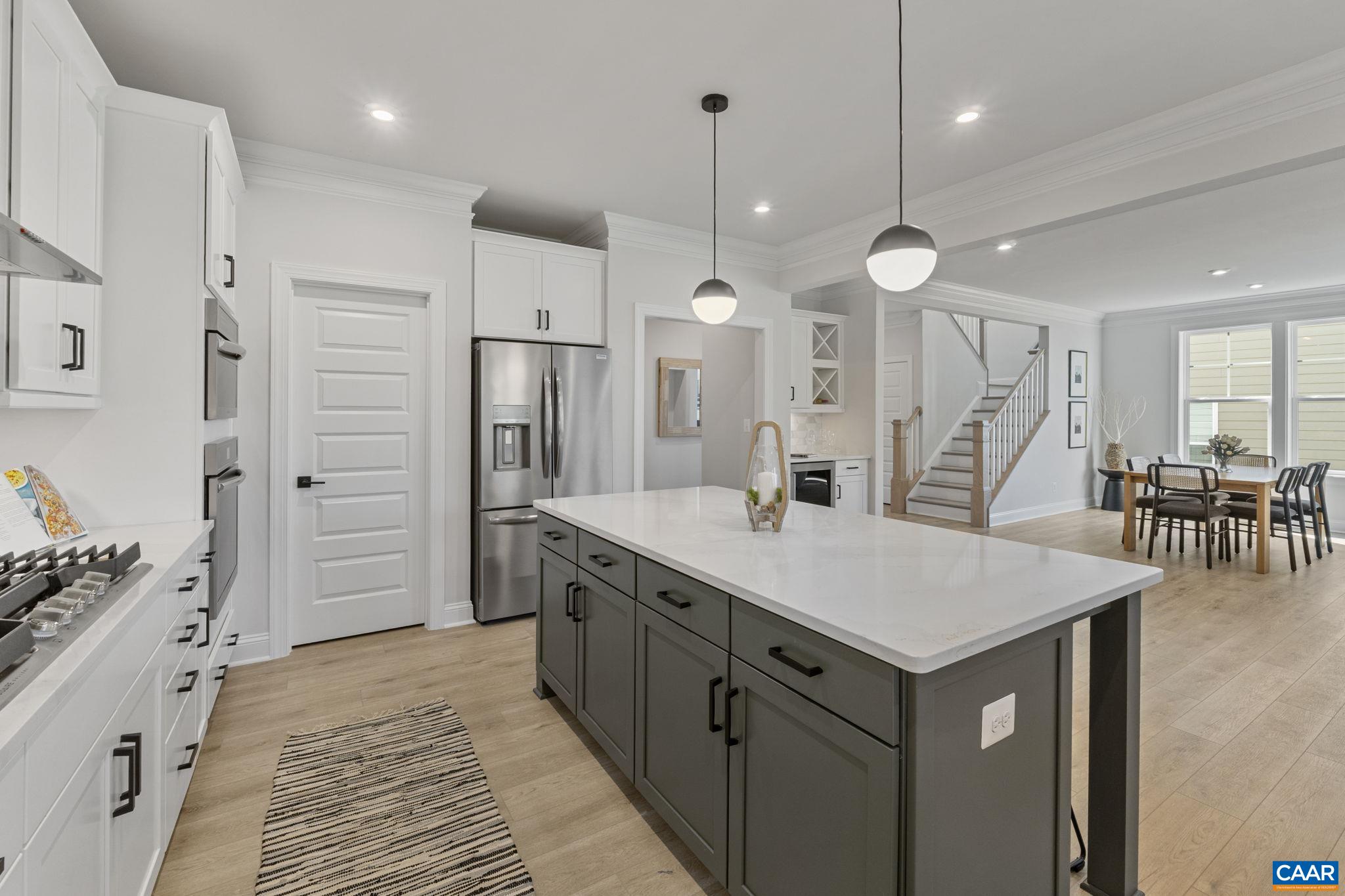 114 D Marcella Street Charlottesville, VA 22911 - Photo 22 of 58 a large kitchen with a table and chairs