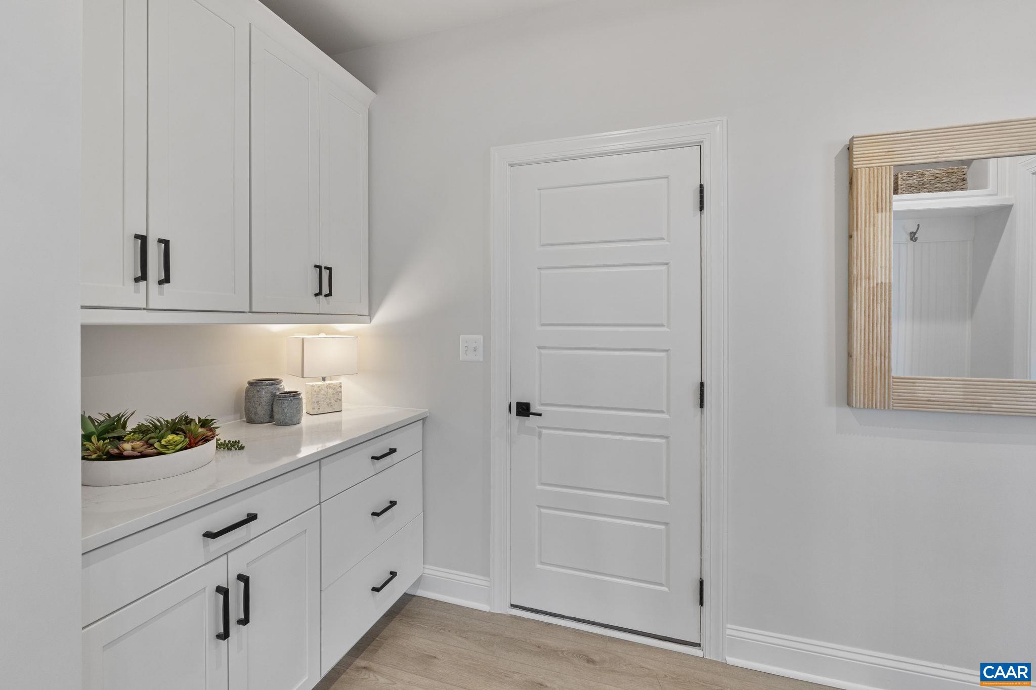 114 D Marcella Street Charlottesville, VA 22911 - Photo 26 of 58 a kitchen with white cabinets and white appliances