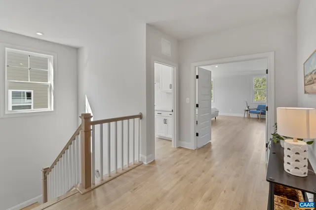 a bedroom with a bed and a table in it