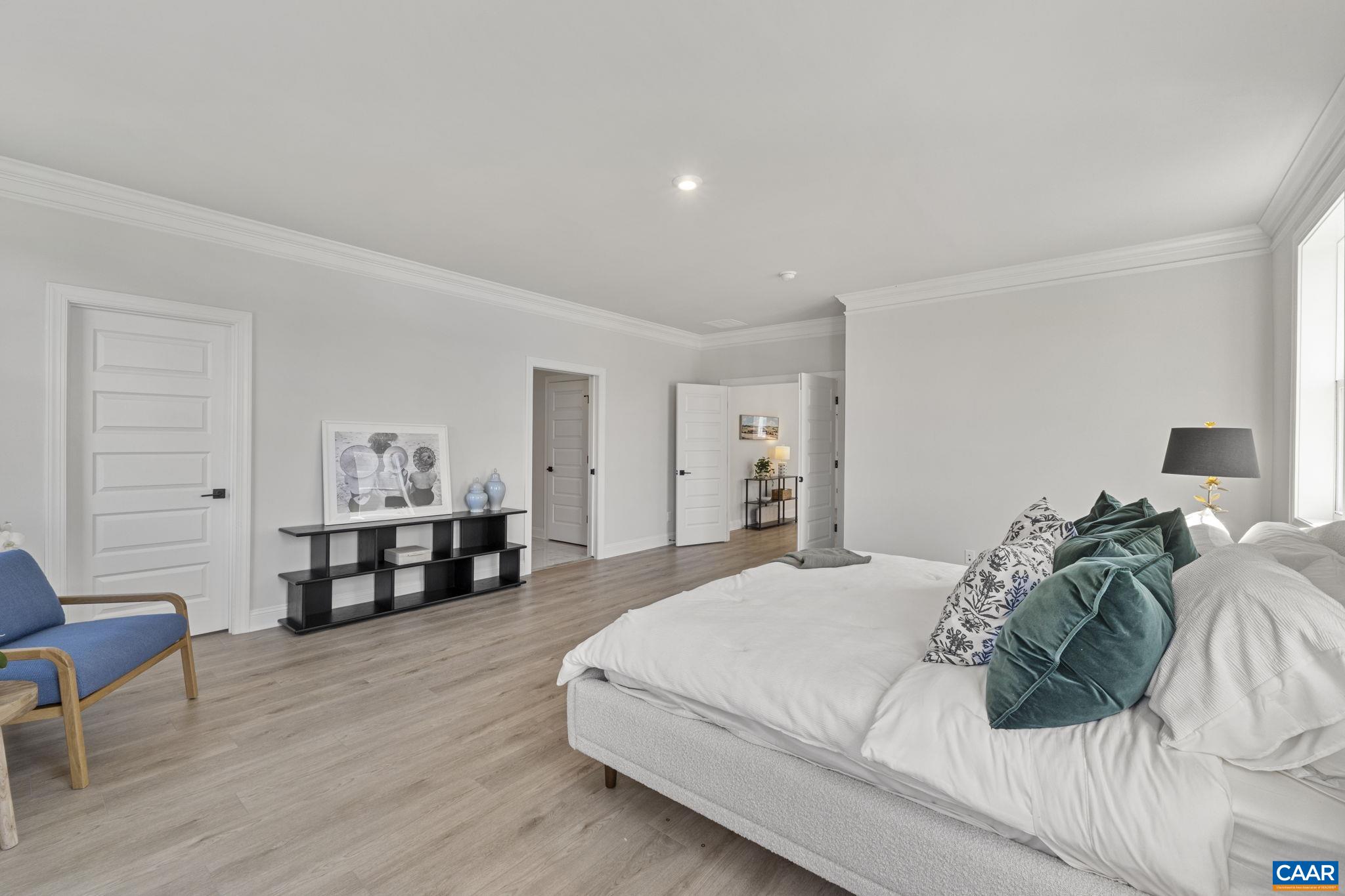 114 D Marcella Street Charlottesville, VA 22911 - Photo 30 of 58 a bedroom with a bed and a table in it