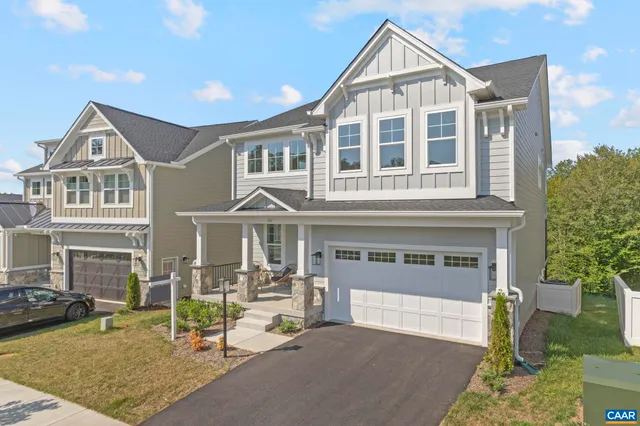 a view of a big house with wooden floor and a yard