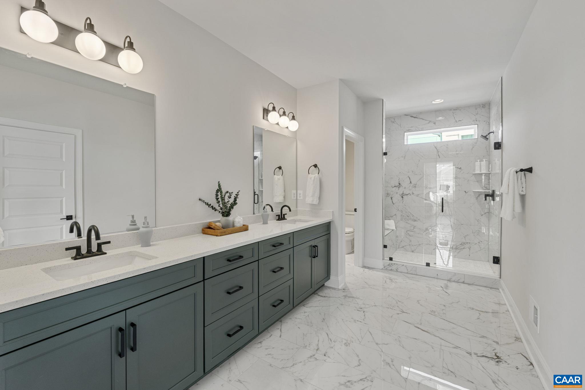 114 D Marcella Street Charlottesville, VA 22911 - Photo 31 of 58 a bathroom with double sink shower and a mirror