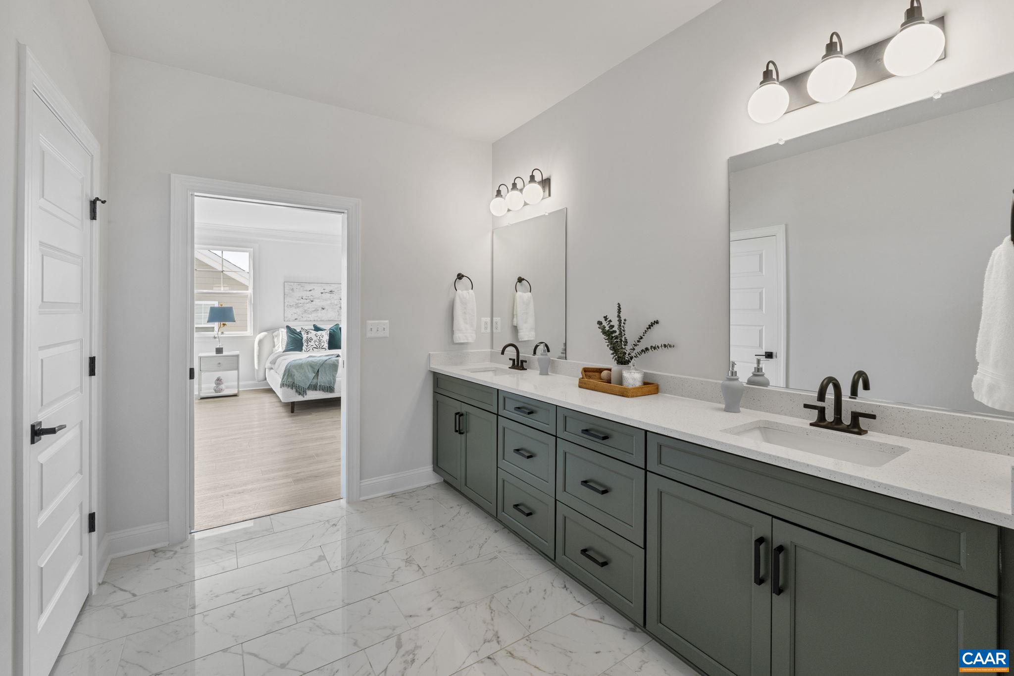 114 D Marcella Street Charlottesville, VA 22911 - Photo 33 of 58 a spacious en suite bathroom with double sink and mirrors