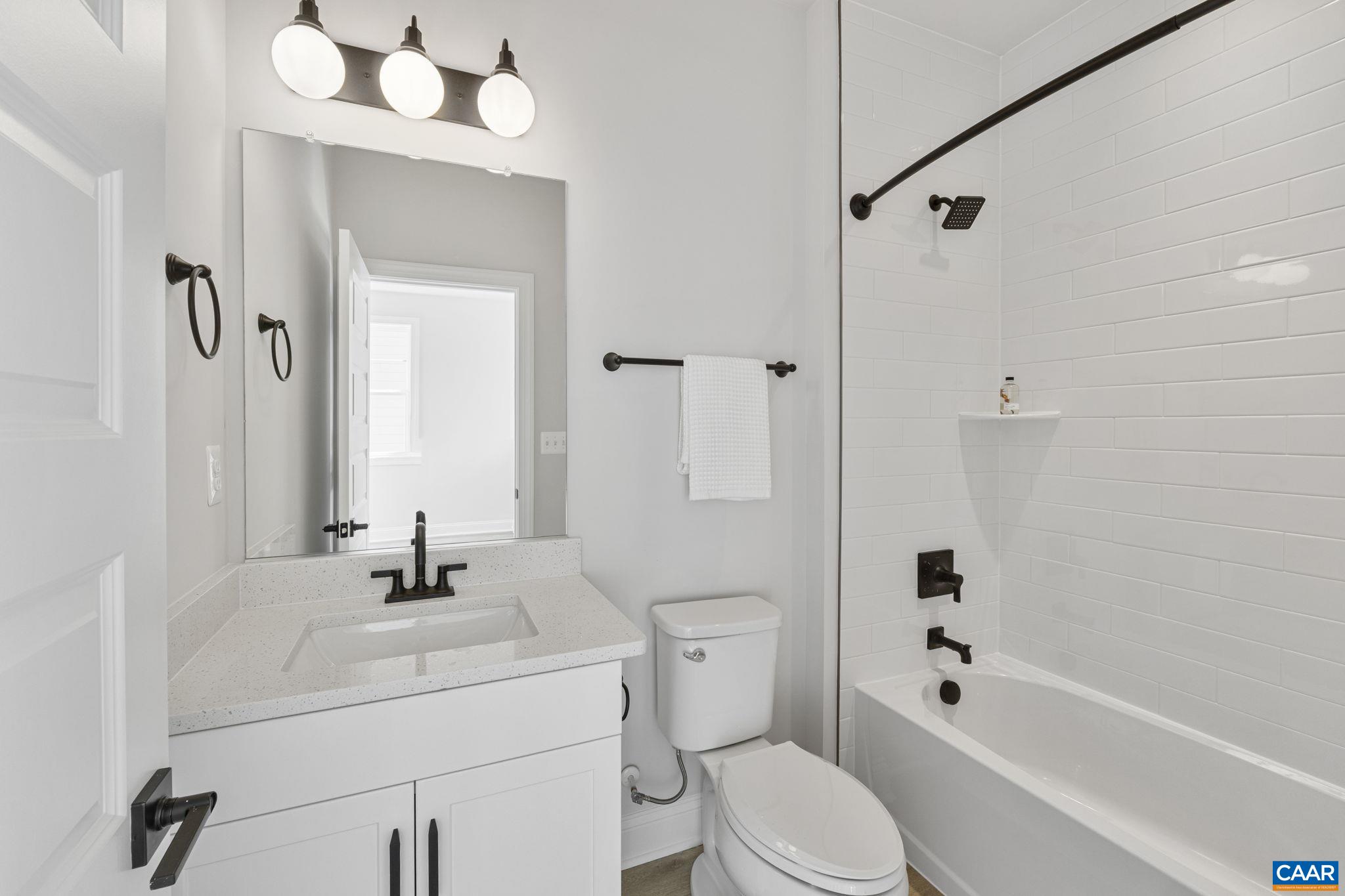 114 D Marcella Street Charlottesville, VA 22911 - Photo 40 of 58 a bathroom with a sink a toilet and shower
