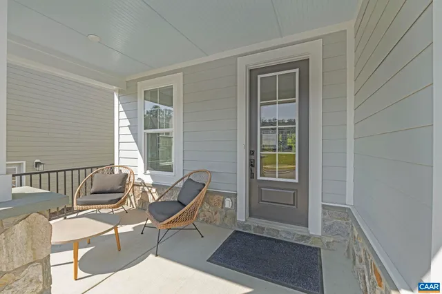 a living room with furniture and windows