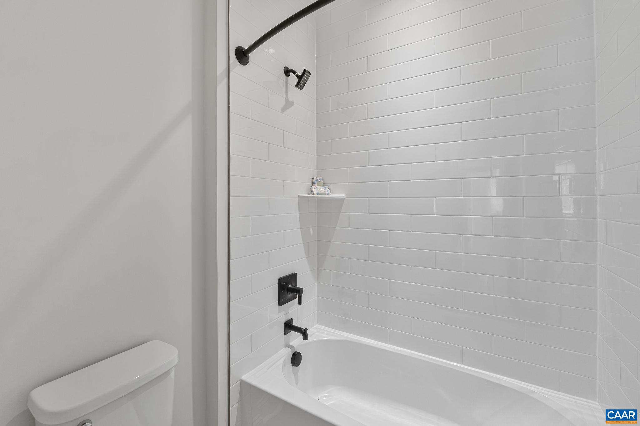 114 D Marcella Street Charlottesville, VA 22911 - Photo 44 of 58 a bathroom with a bathtub and a toilet