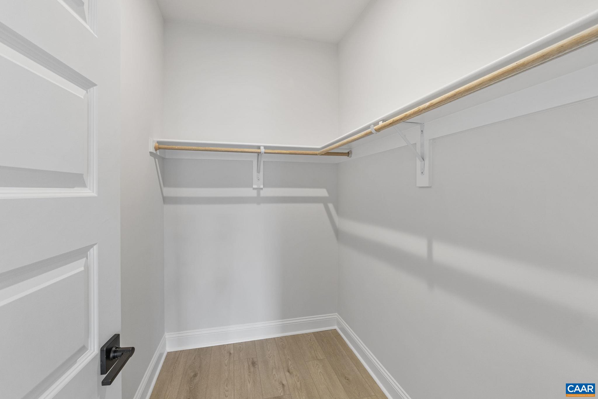 114 D Marcella Street Charlottesville, VA 22911 - Photo 45 of 58 a view of a room with racks on the wall