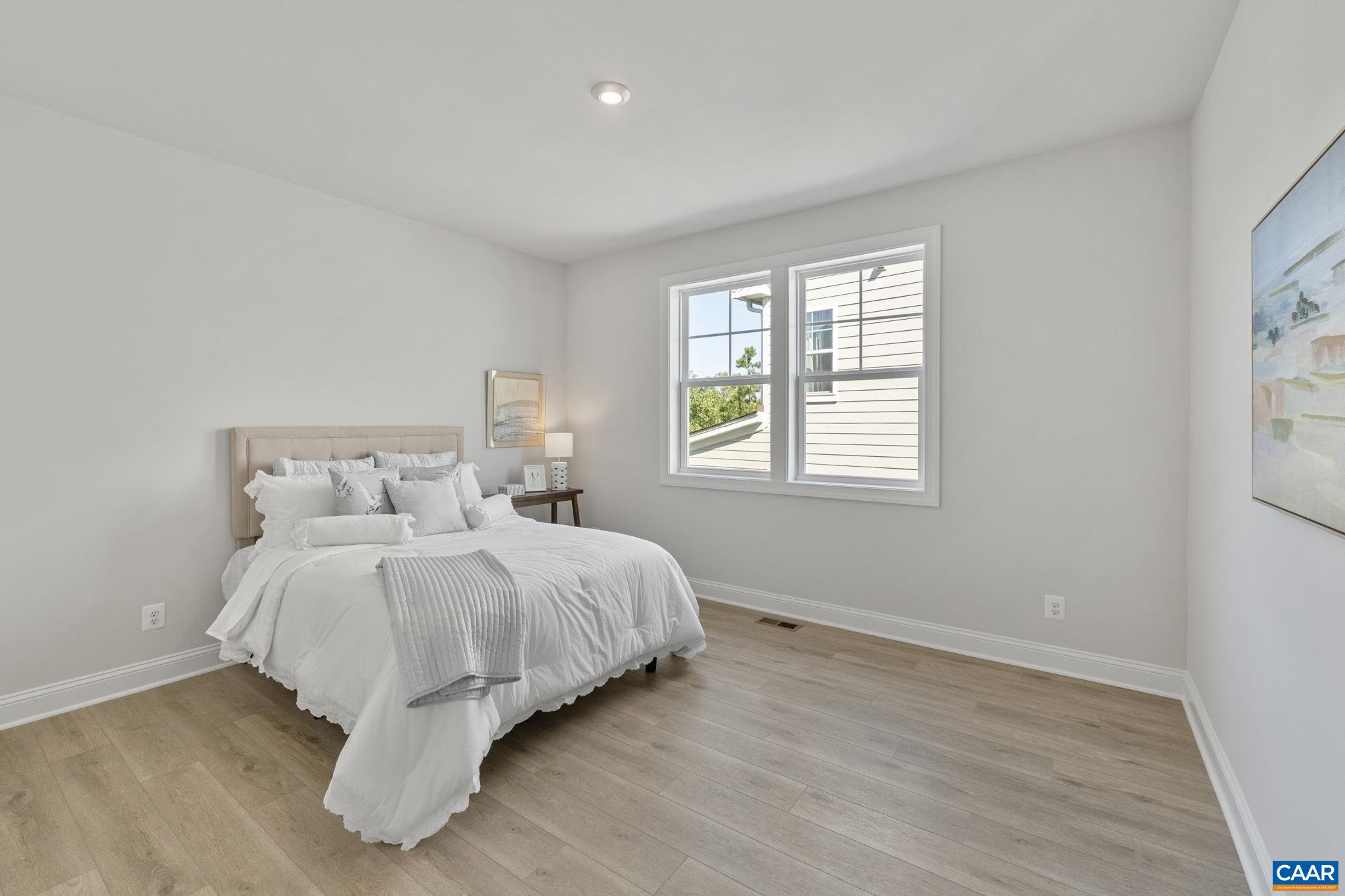 114 D Marcella Street Charlottesville, VA 22911 - Photo 46 of 58 a bed room with a bed and a window