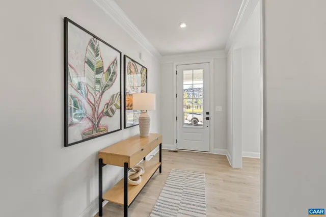 a view of a hallway with paintings on the wall