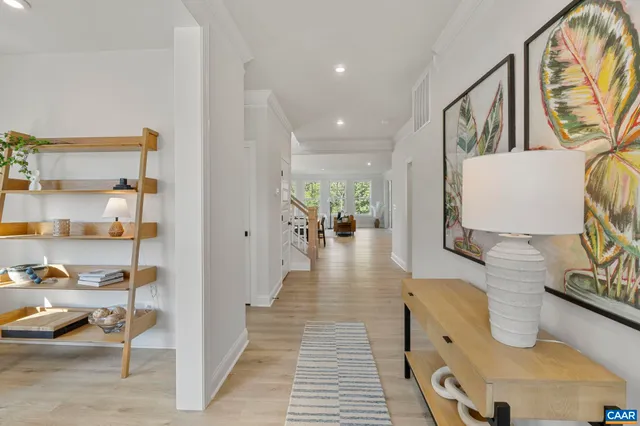 a view of living room with furniture and wooden floor