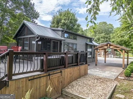 a view of a house with wooden fence