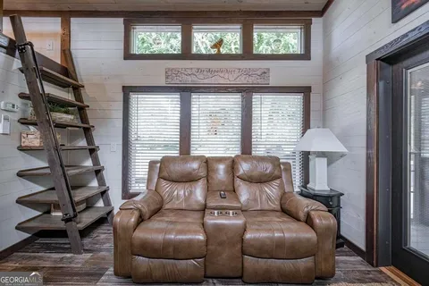 a living room with a fireplace and a window