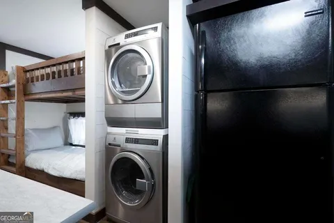 a view of a room with furniture and wooden floor