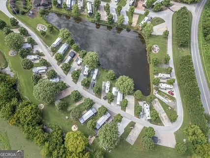 an aerial view of a house with a lake view