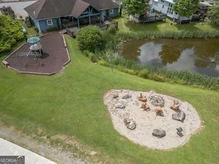 an aerial view of residential house with outdoor space and street view