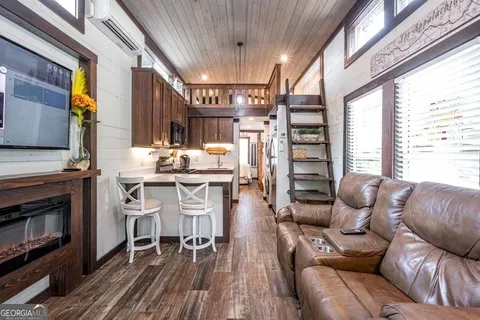 a dining room with furniture and a fireplace