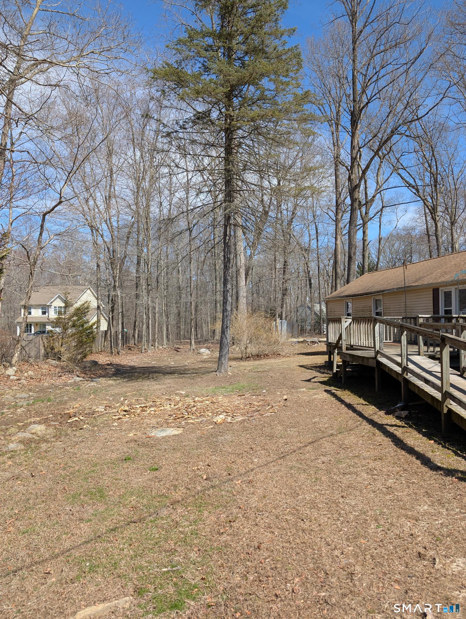 97 Bushy Hill Road Deep River, CT 06417 - Photo 27 of 28 a view of a house with a yard covered in snow