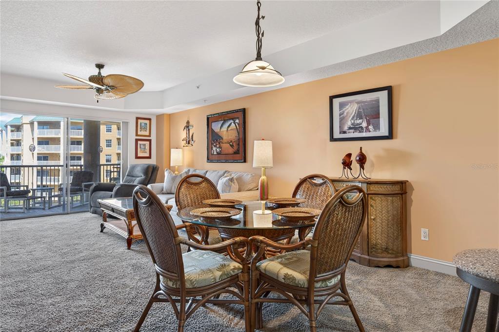 4670 Links Village Drive, Unit D506 Ponce Inlet, FL 32127 - Photo 11 of 60 a view of a dining room with furniture