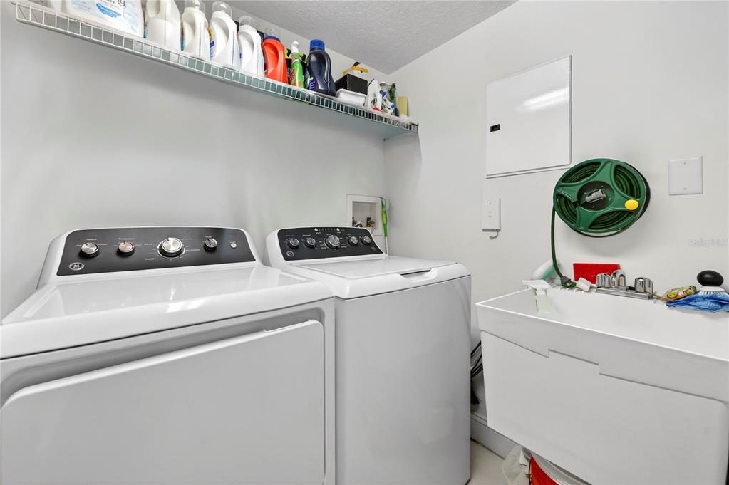 4670 Links Village Drive, Unit D506 Ponce Inlet, FL 32127 - Photo 33 of 60 a utility room with dryer and washer