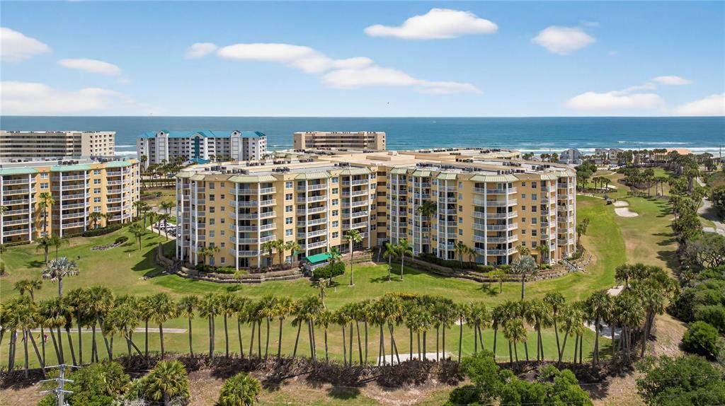 4670 Links Village Drive, Unit D506 Ponce Inlet, FL 32127 - Photo 35 of 60 a view of building with garden space