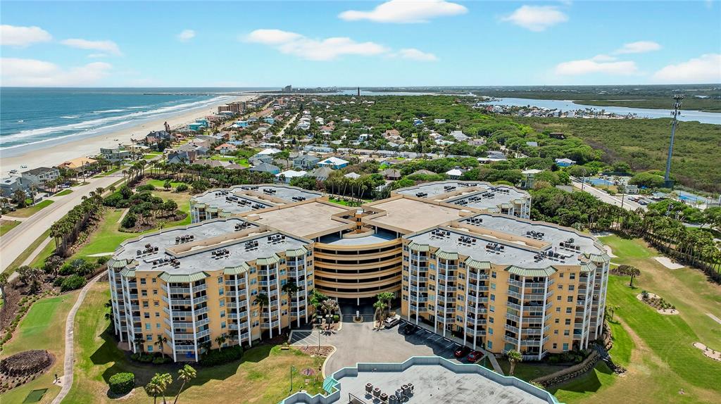 4670 Links Village Drive, Unit D506 Ponce Inlet, FL 32127 - Photo 37 of 60 a view of a city with an ocean