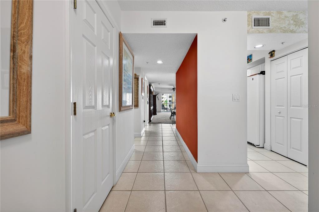 4670 Links Village Drive, Unit D506 Ponce Inlet, FL 32127 - Photo 4 of 60 a view of a hallway with a furniture