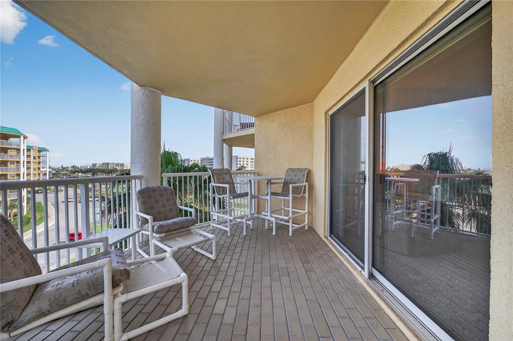 4670 Links Village Drive, Unit D506 Ponce Inlet, FL 32127 - Photo 56 of 60 a view of a balcony with chairs