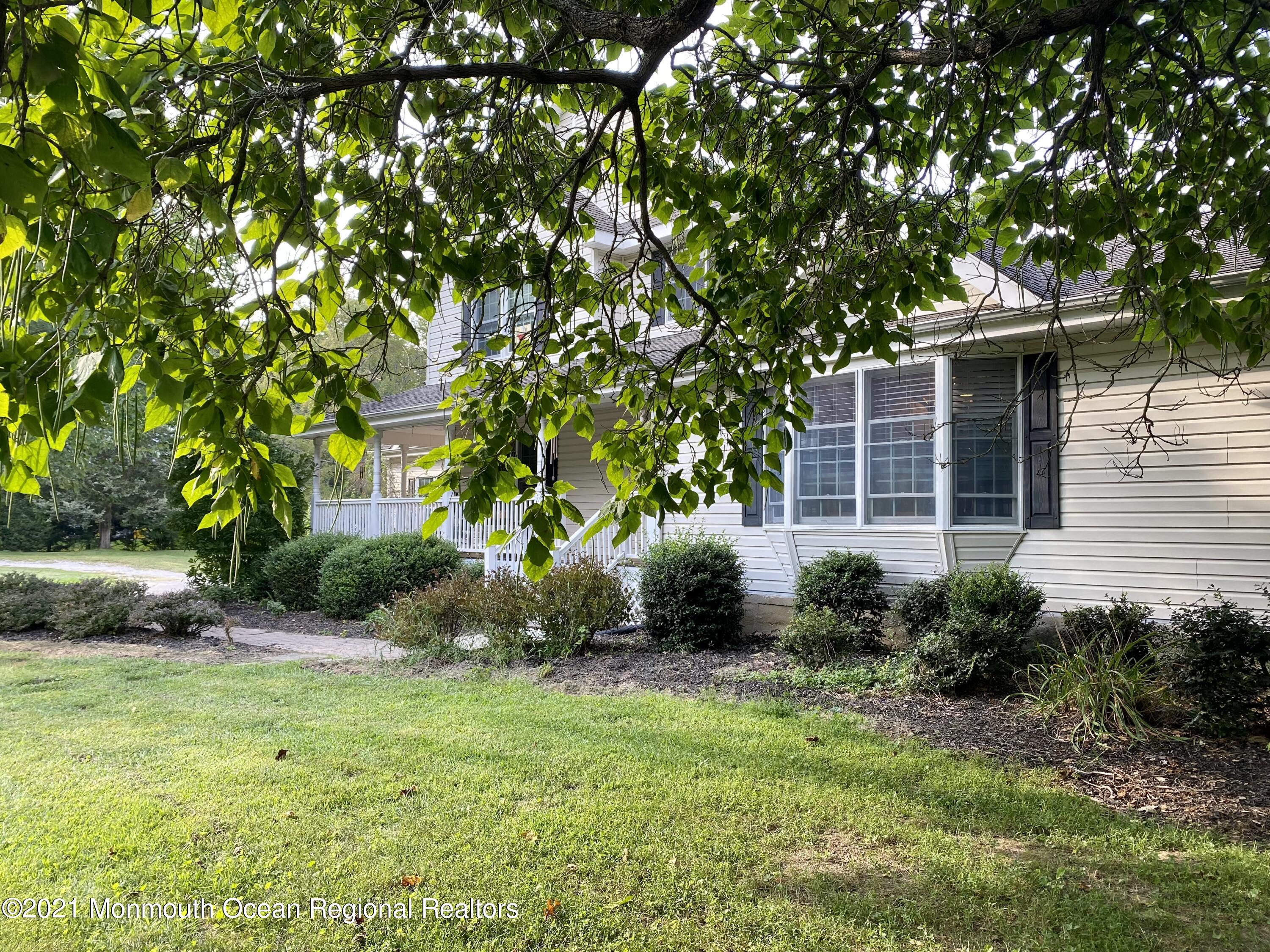 390 Cobain Road Jackson, NJ 08527 - Photo 50 of 53 a front view of a house with garden