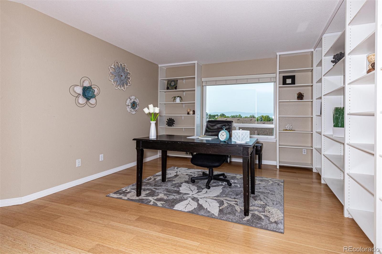 9939 Clyde Circle Highlands Ranch, CO 80129 - Photo 14 of 37 a view of a workspace with furniture and a window
