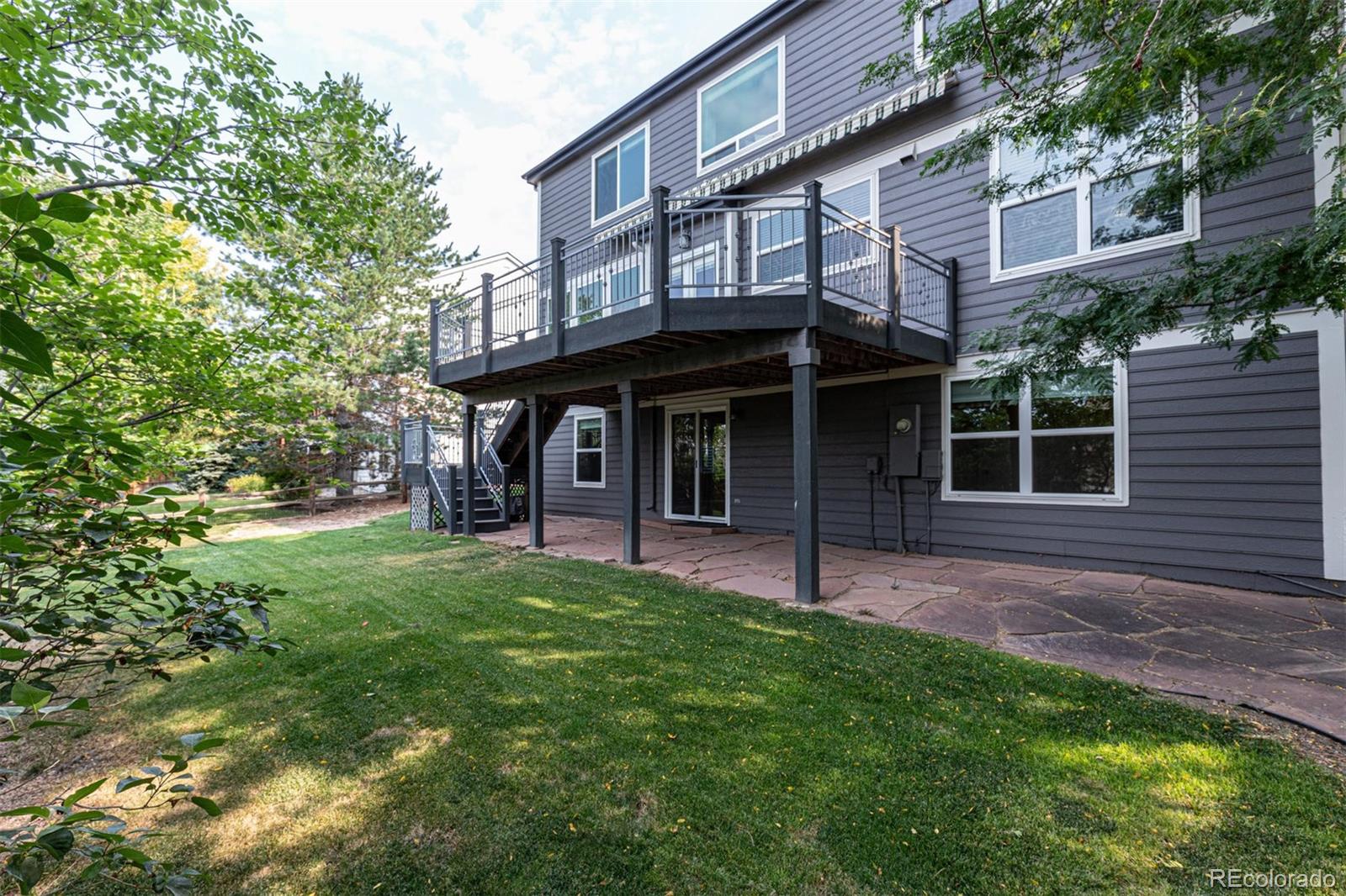 9939 Clyde Circle Highlands Ranch, CO 80129 - Photo 33 of 37 a view of an house with backyard porch and sitting area
