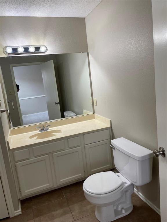 12 Trails Place, Unit AD Wylie, TX 75098 - Photo 17 of 40 a bathroom with a toilet sink and mirror