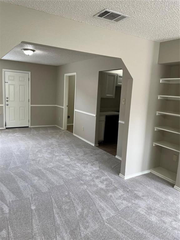 12 Trails Place, Unit AD Wylie, TX 75098 - Photo 20 of 40 a view of an empty room with a cabinet and stairs